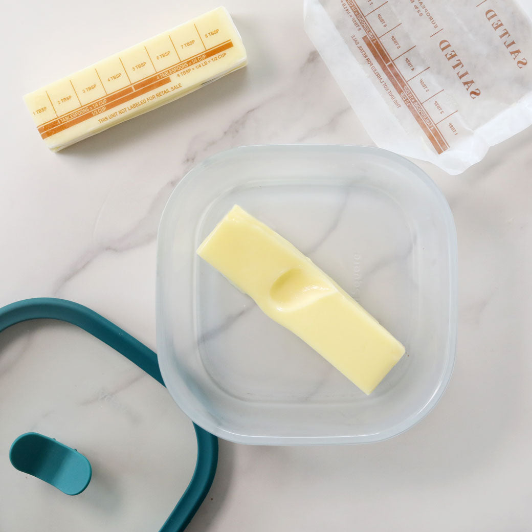 A pat of butter in an Anyday dish, softened in the microwave until smooth and spreadable.