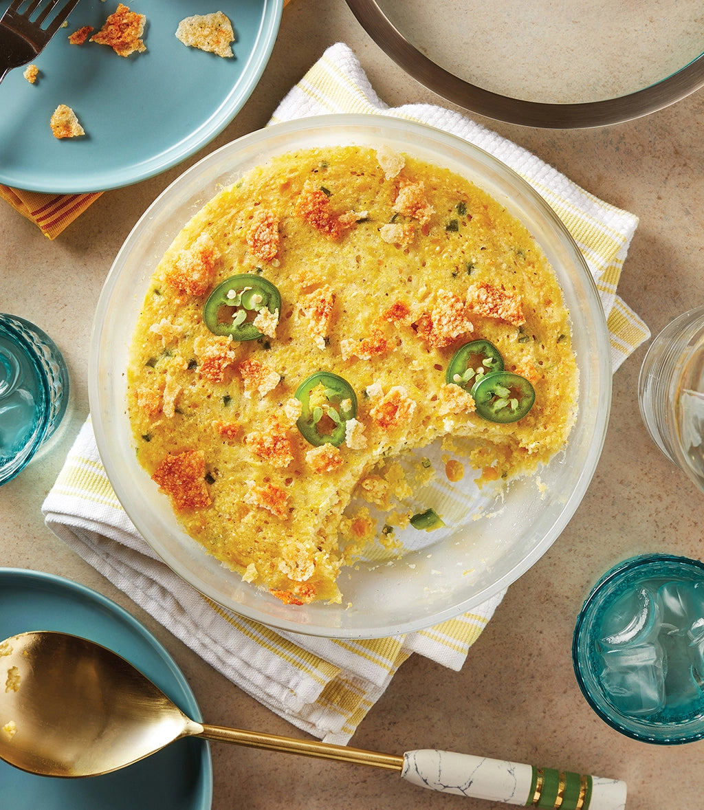 Creamy Corn Spoonbread made and served in the glass Anyday dish, featuring a moist and fluffy cornmeal bread with a rich, creamy texture.