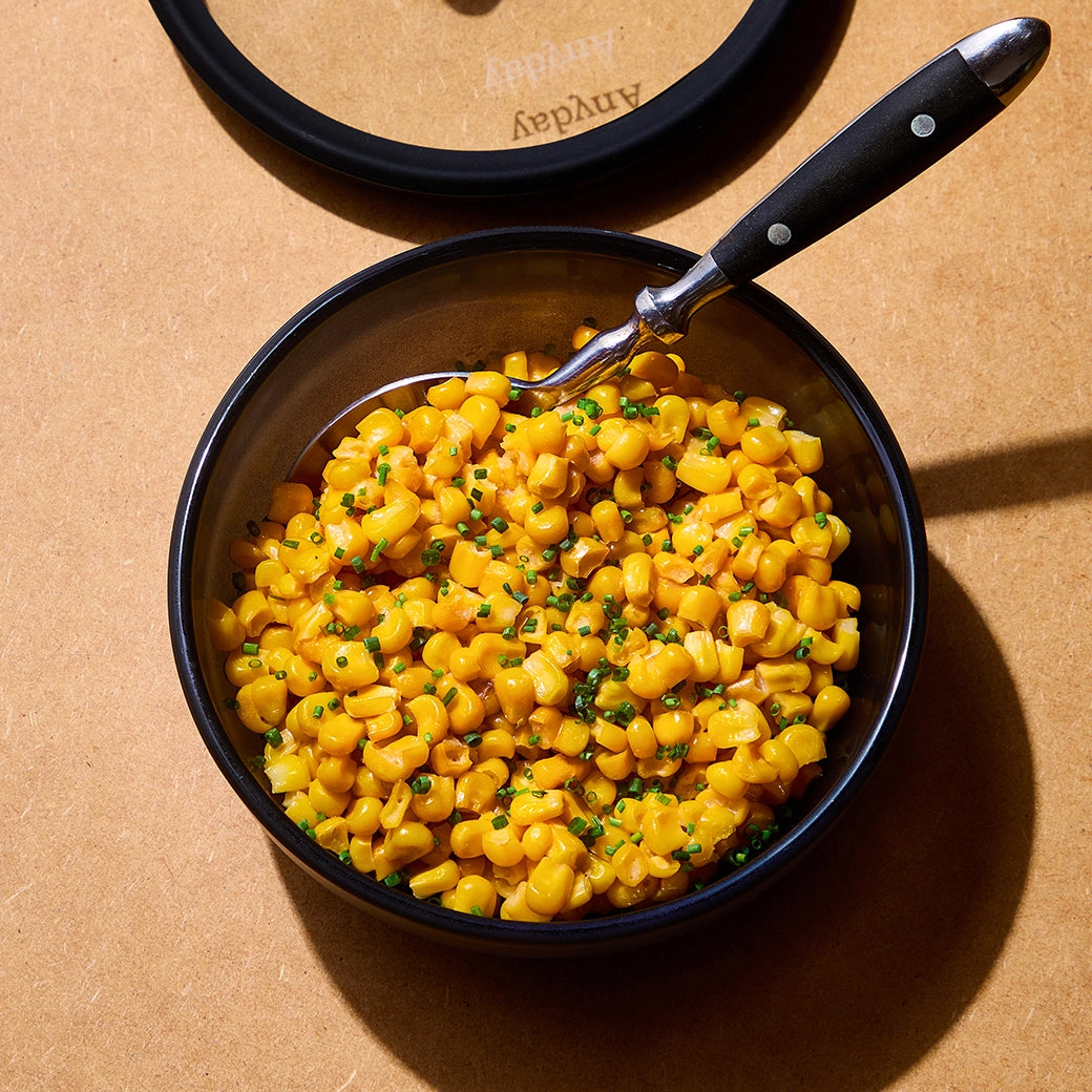 Flavorful miso butter corn made in the glass Anyday dish, featuring sweet corn kernels tossed in a savory blend of miso paste, butter, and soy sauce. This quick and simple microwave recipe ensures a deliciously rich and umami-packed side dish, perfect for any meal.