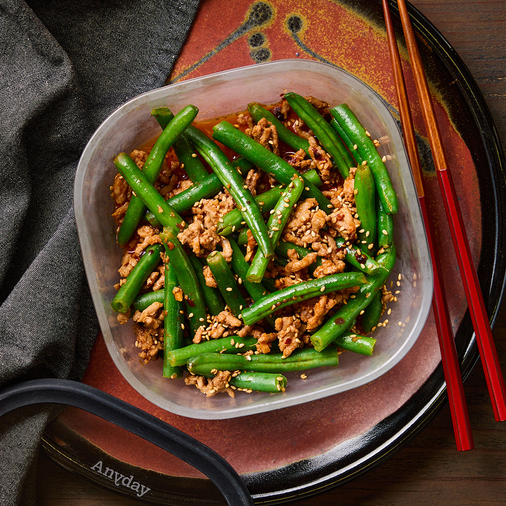 Microwave Green Beans and Spicy Pork cooked in an Anyday dish—tender green beans and flavorful pork in a bold, savory sauce for a quick and satisfying meal.