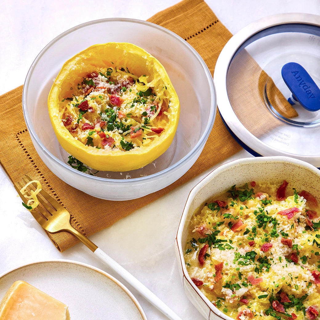 Spaghetti squash carbonara cooked in the microwave using the glass Anyday dish, delivering tender squash strands mixed with creamy sauce and crispy pancetta. Enjoy a quick, low-carb twist on a classic dish with no waiting for the water to boil, ready in minutes.
