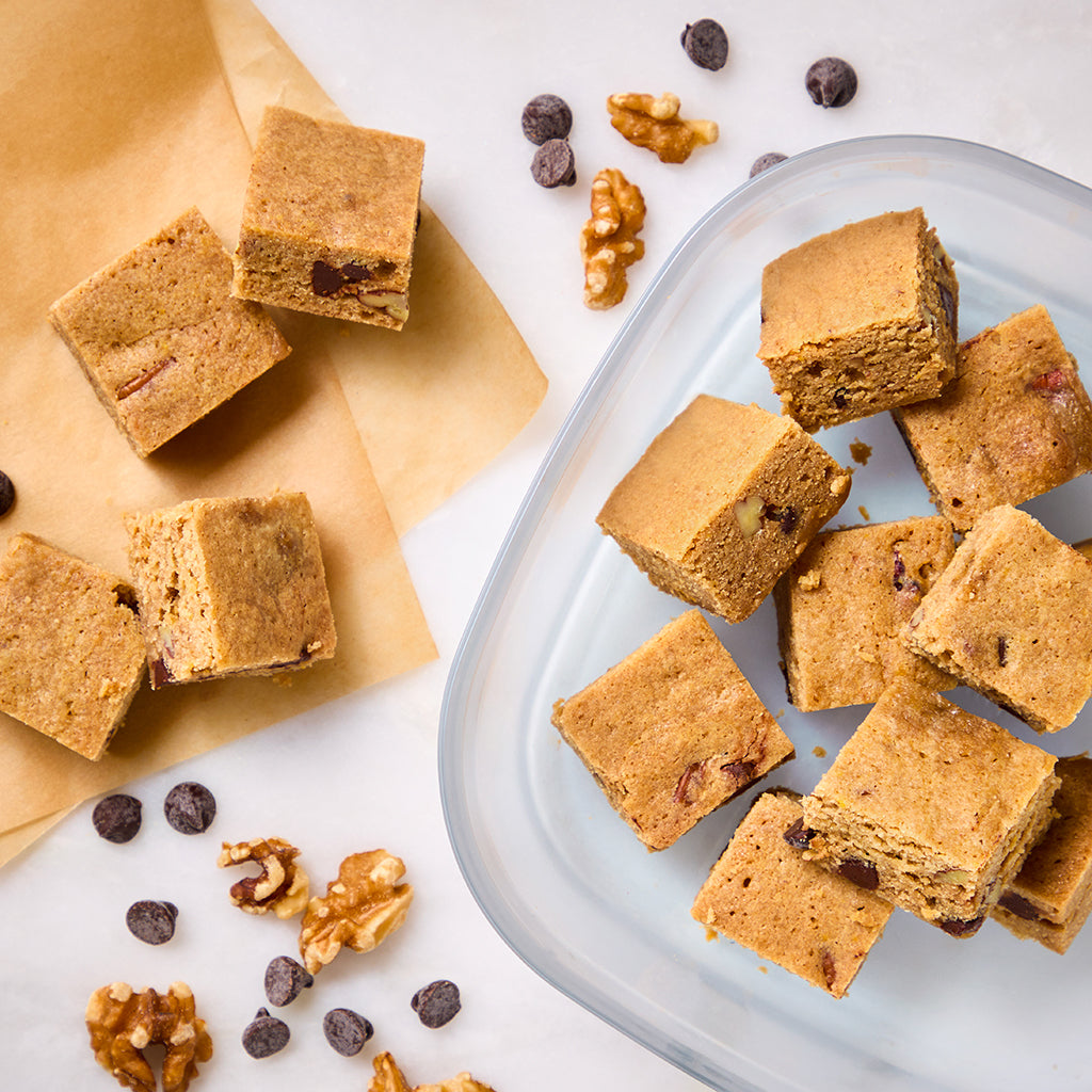 Delicious blondies made in a square Anyday dish in the microwave, featuring a rich, chewy texture and optional nuts for added crunch. This easy recipe is perfect for satisfying your sweet tooth in no time.
