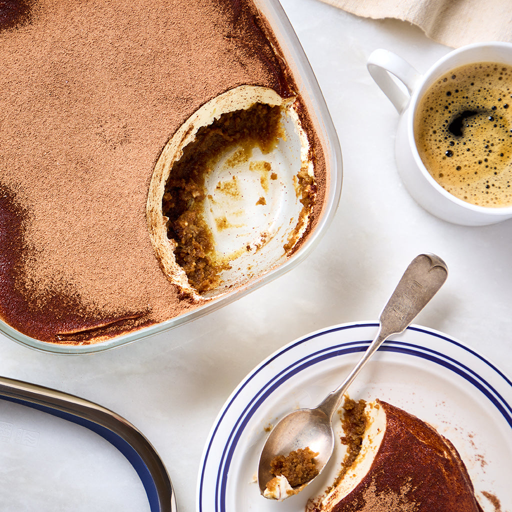 Delicious tiramisu is made in an Anyday dish, featuring layers of coffee-soaked sponge cake made in the microwave, rich mascarpone cream, and a dusting of cocoa powder.