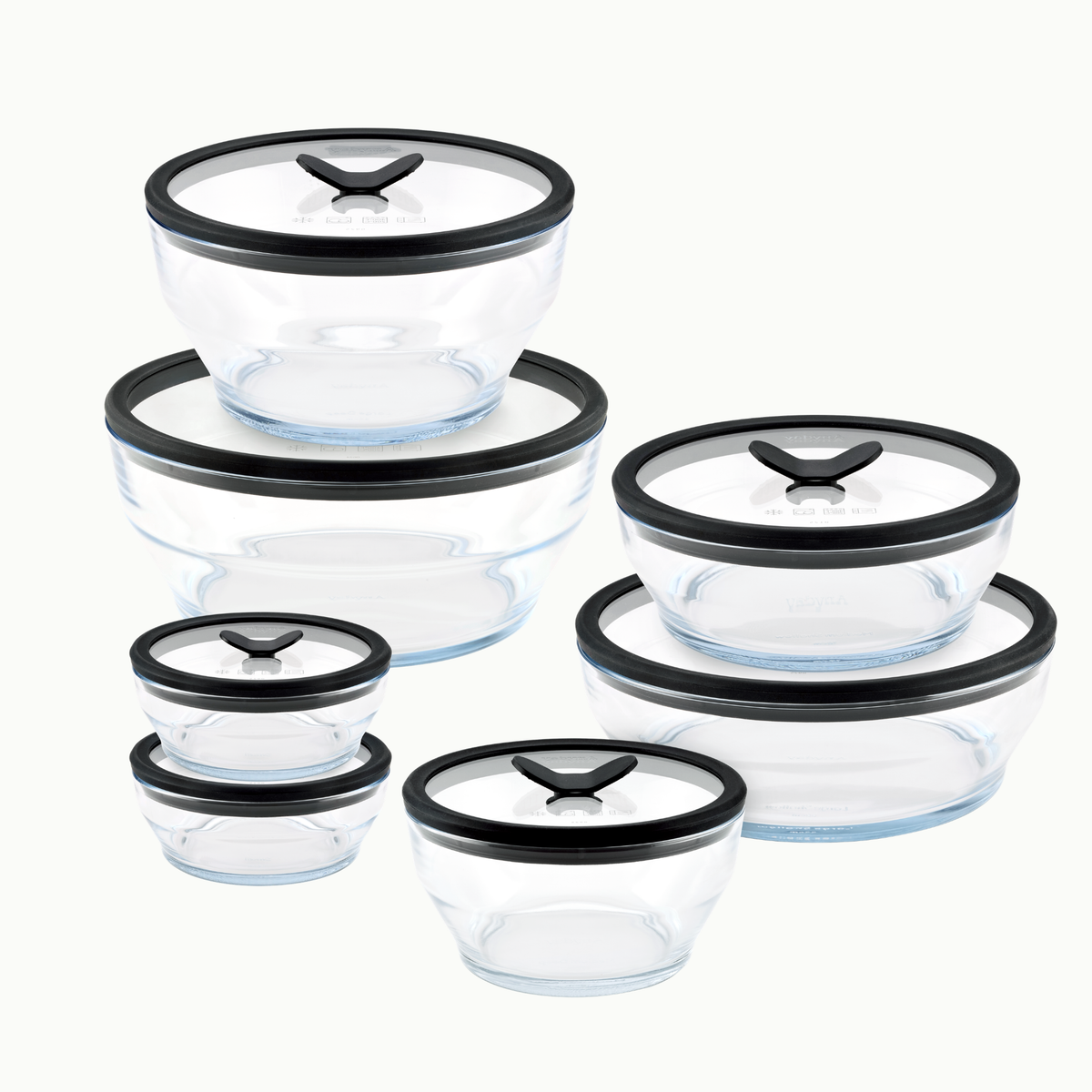 A 14-piece clear glass round dish set with black and transparent airtight lids, arranged in a staggered pattern against a white background—perfect for a plastic-free kitchen.