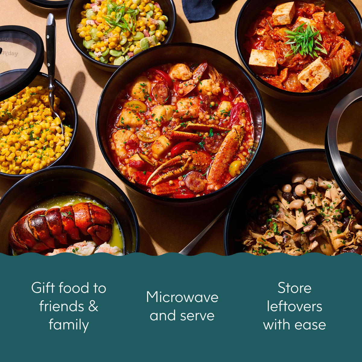 The Onyx Gift Bundle features dark-colored silicone bowls filled with seafood stew, corn, kimchi with tofu, and sautéed mushrooms, accompanied by silicone storage lids and text detailing gift, microwave, and food storage uses.
