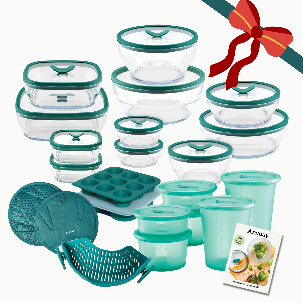 The Everything but the Microwave Bundle (kale) featuring glass food storage containers, silicone containers, a muffin pan, oven mitts, and a microwave cooking guide.