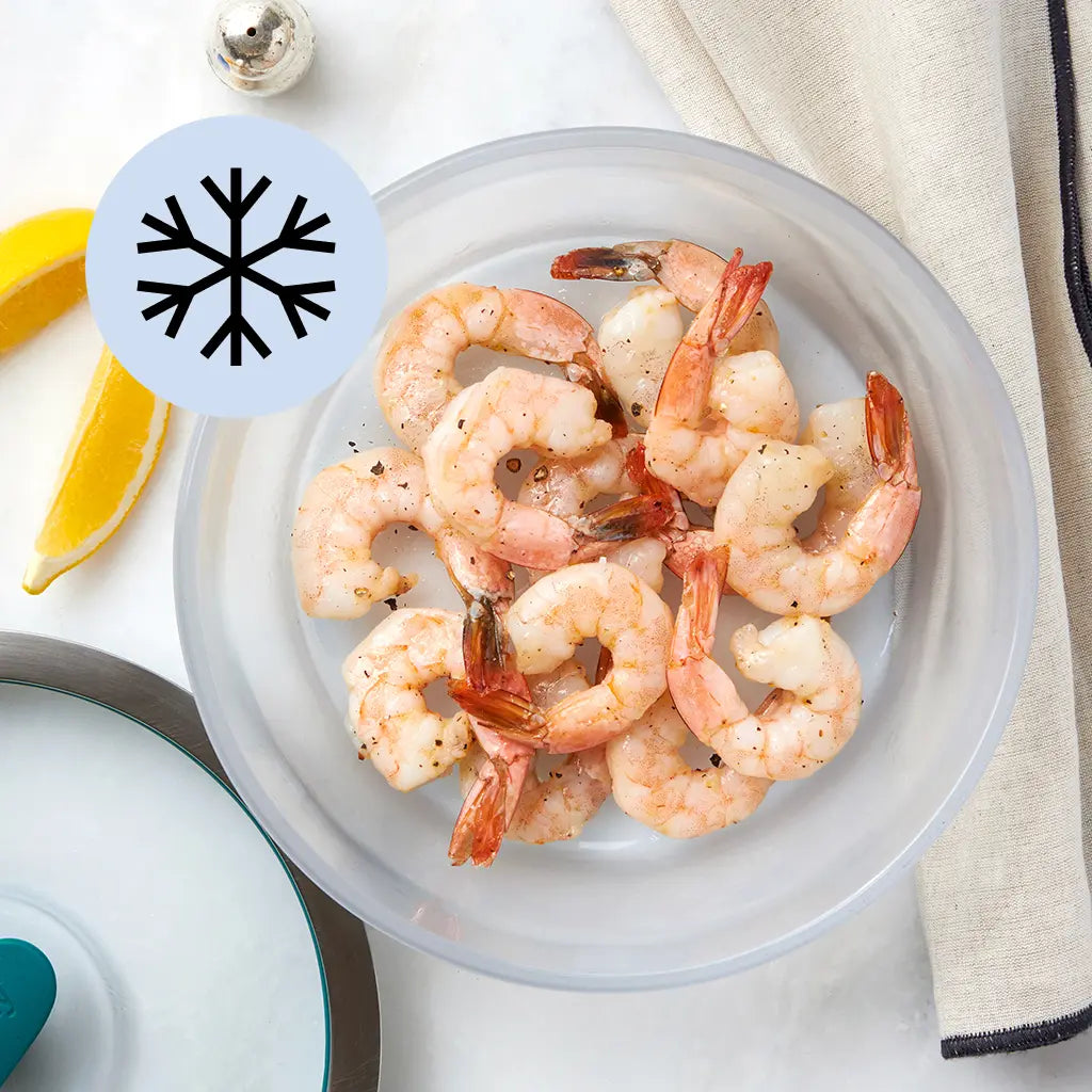 Peeled frozen shrimp arranged in a clear Anyday dish on a light surface