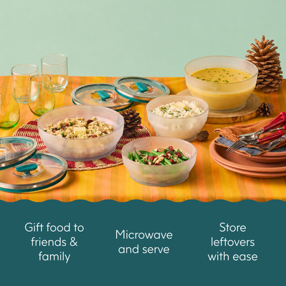 The Anyday Starter Gift Bundle (black) features glass bowls with teal-accented silicone lids filled with food, accompanied by text that reads Gift food to friends & family, Microwave and serve, and Store leftovers with ease.