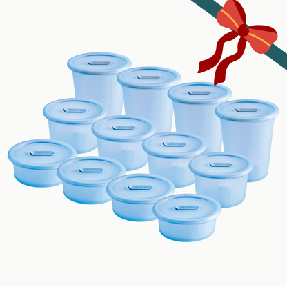 Twelve Ice-colored The Anydeli Lovers Bundle silicone storage boxes with matching tops arranged in a grid, decorated with a festive red ribbon in the top right corner.