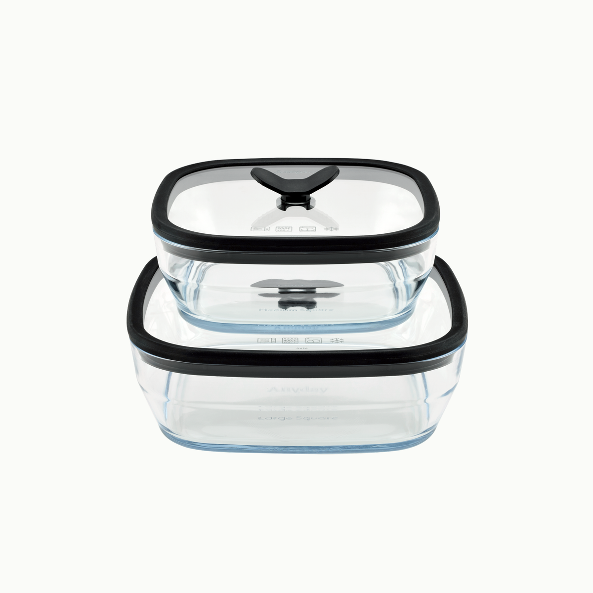 Two square frosted glass 4-Piece Glass Square Dish Set containers in Black Sesame with glass lids stacked on top of each other.