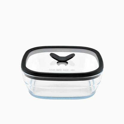 Anyday 5.5-Cup Glass Square Shallow Dish in Black Sesame, a square frosted glass food storage container with a vented glass lid, featuring a black rim and a black center handle.
