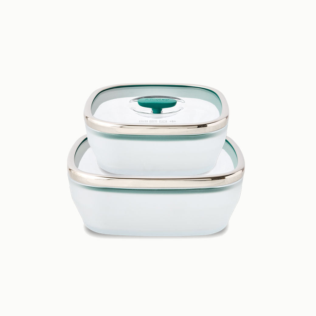Two kale-colored 4-Piece Glass Square Dish Set dishes with glass lids stacked on top of one another for silicone-free kitchen storage.