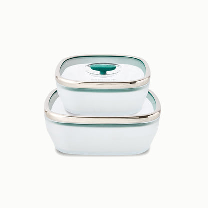 Two kale-colored 4-Piece Glass Square Dish Set dishes with glass lids stacked on top of one another for silicone-free kitchen storage.