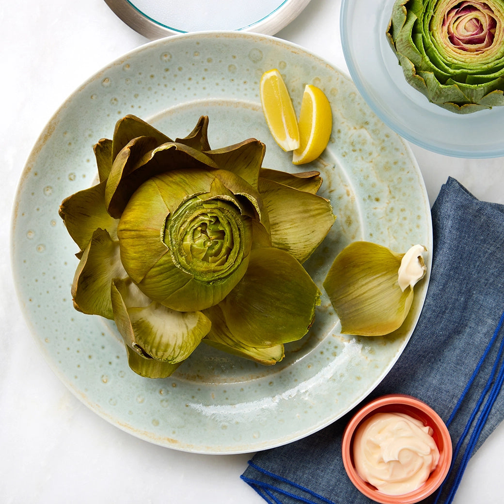 Artichokes cooked and served in the glass Anyday dish, featuring tender, steamed artichokes perfect for a healthy and delicious side dish.