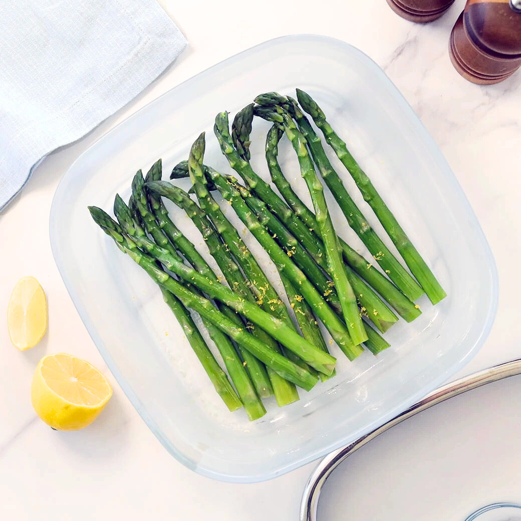 Asparagus cooked and served in the glass Anyday dish, featuring tender, steamed asparagus spears perfect as a healthy side dish.