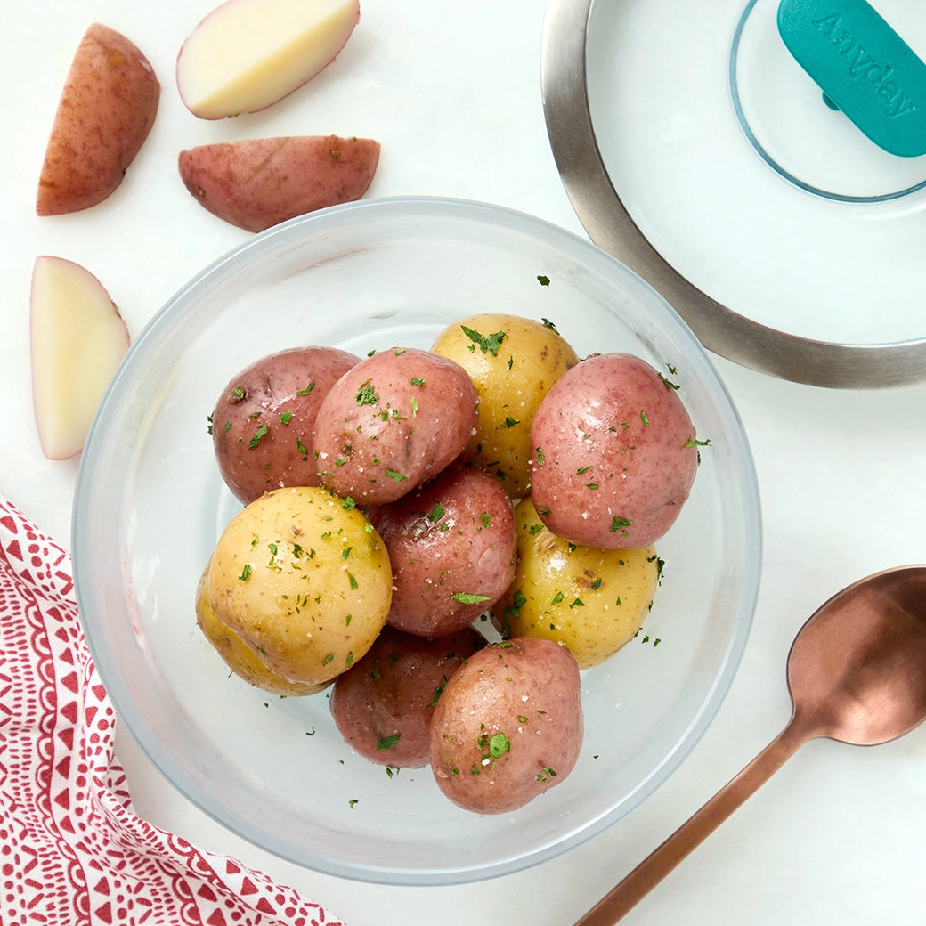 Perfectly cooked baby potatoes made and served in the glass Anyday dish, providing tender and flavorful potatoes. This method ensures evenly cooked baby potatoes, ideal for mashing, roasting, or as a side dish for any meal.