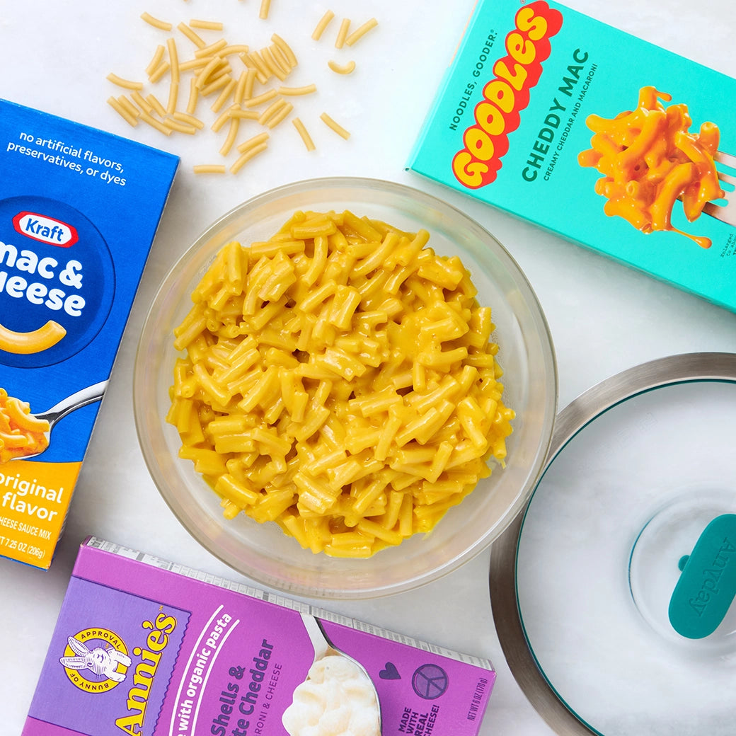 Boxed Mac and Cheese cooked and served in the glass Anyday dish, featuring creamy and cheesy pasta prepared quickly without the need to pre-boil the water.