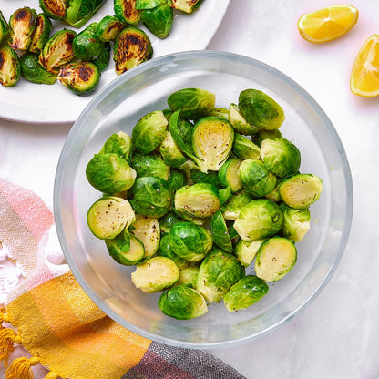 Perfectly cooked Brussels sprouts made and served in the glass Anyday dish, providing a flavorful and nutritious side dish. This method ensures tender, evenly cooked Brussels sprouts, ideal for any meal.
