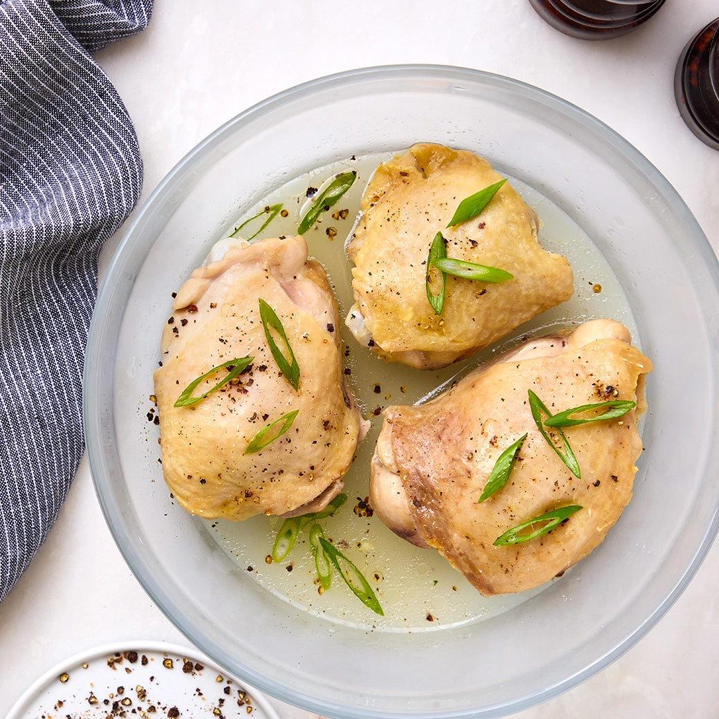 Perfectly cooked chicken thighs made and served in the glass Anyday dish, providing tender and flavorful meat. This method ensures evenly cooked chicken thighs, ideal for enjoying as a main dish or adding to various recipes.