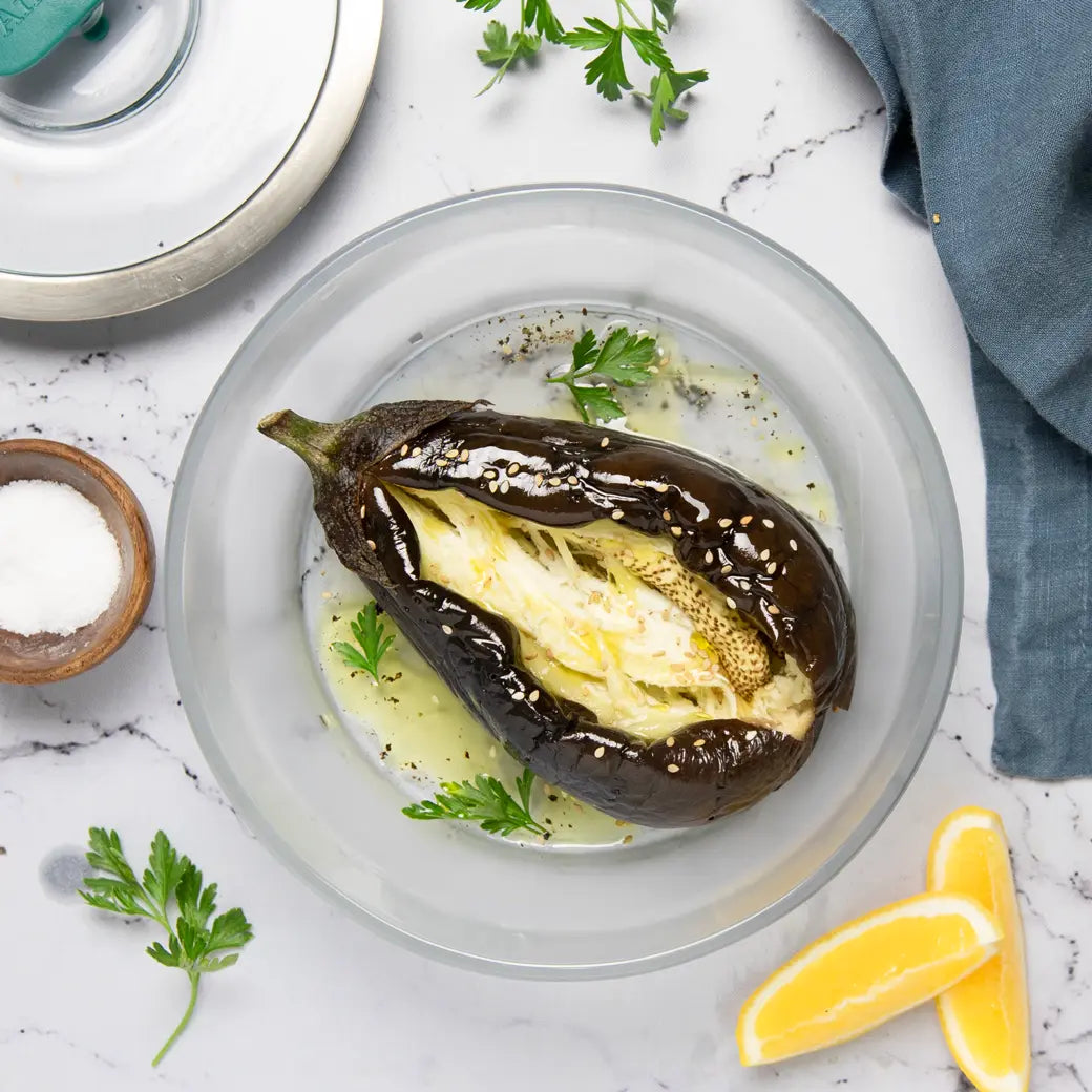 Eggplant cooked and served in the glass Anyday dish, featuring tender and perfectly cooked whole eggplant that can be seasoned with your favorite herbs, spices and sauces or turn into a dip or side dish of your choice..