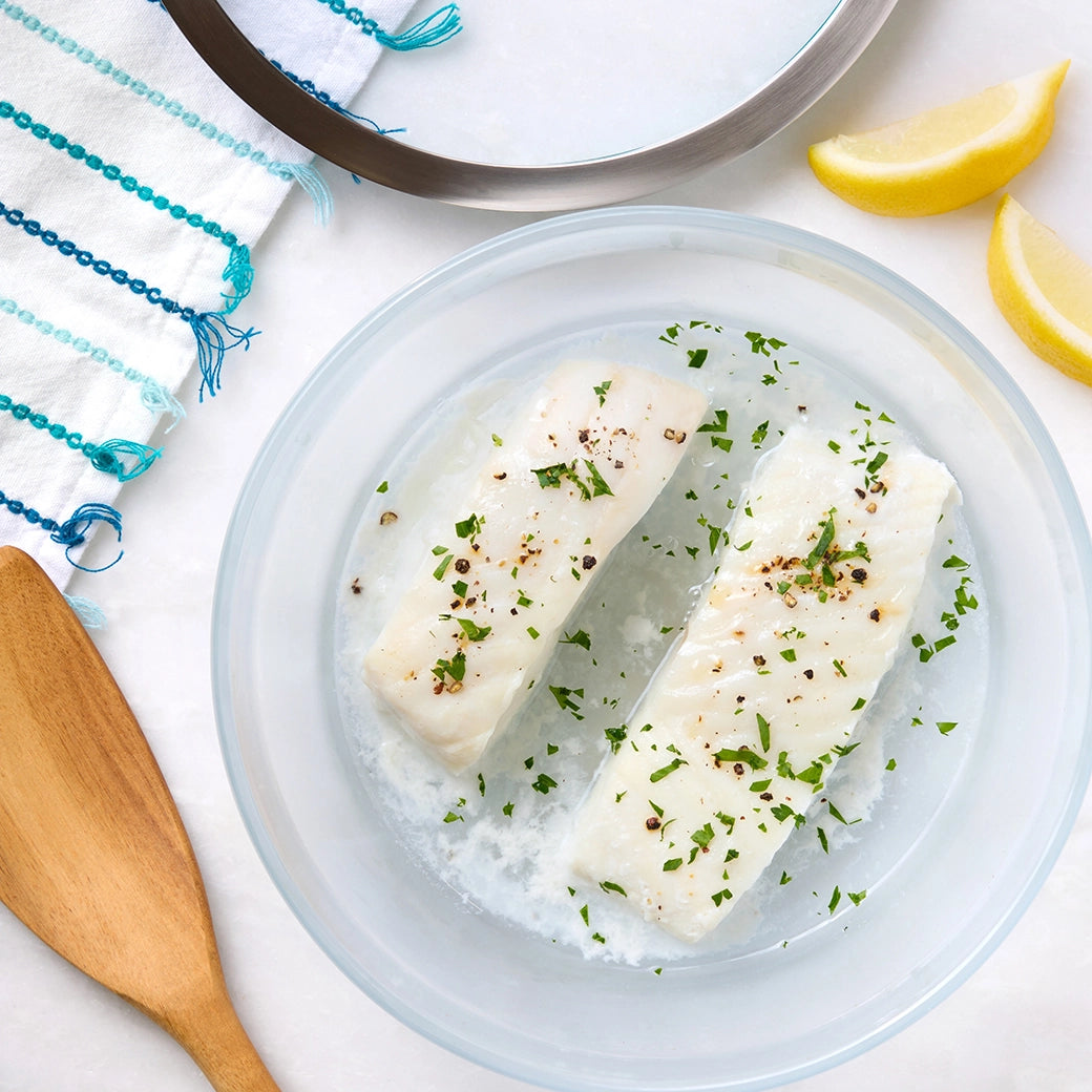 Perfectly cooked fresh halibut made and served in the glass Anyday dish, providing tender and flaky fish fillets. This method ensures evenly cooked halibut, ideal for a quick and healthy main dish.