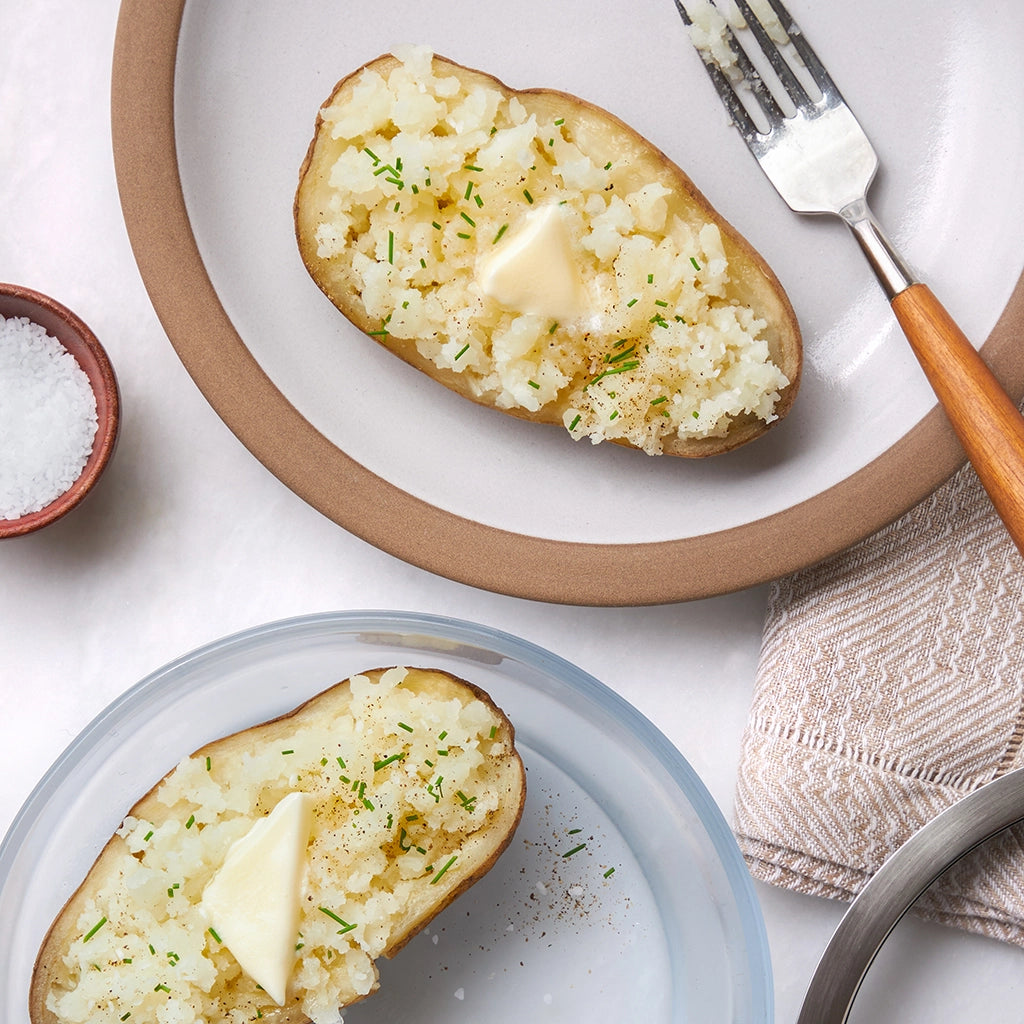 Potatoes cooked and served in the glass Anyday dish, featuring perfectly cooked potatoes, ideal for mashing, or other preparations.