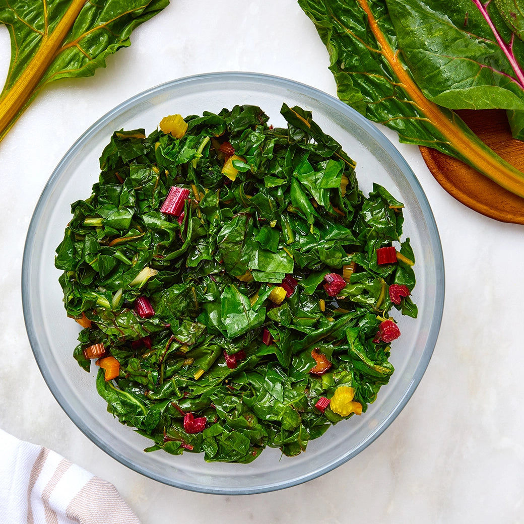 Perfectly cooked Swiss chard made and served in the glass Anyday dish, providing tender and flavorful greens. This method ensures evenly cooked Swiss chard, ideal for a nutritious side dish or adding to various recipes.