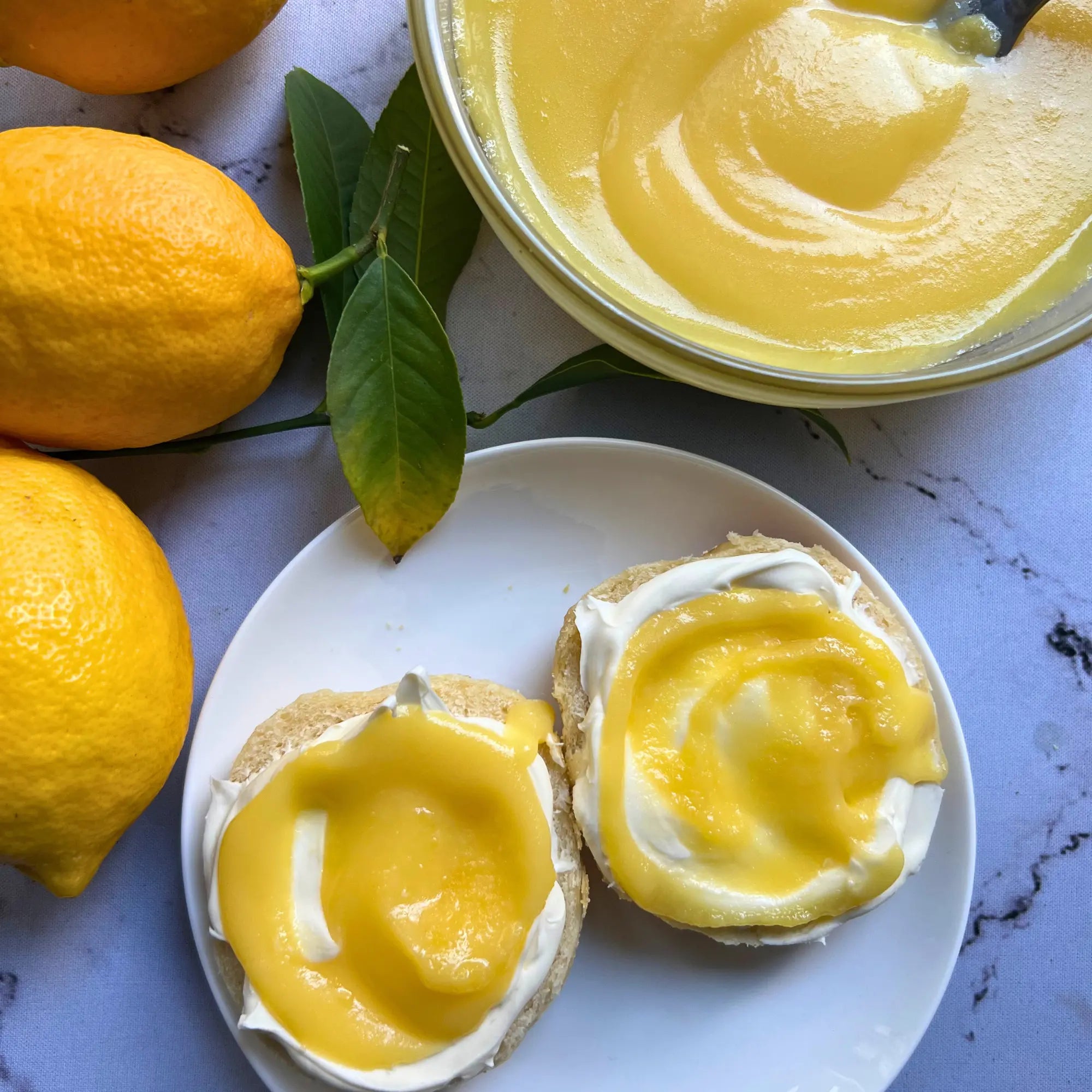 Perfectly cooked no-stir lemon curd made and served in the glass Anyday dish, providing a creamy, sweet, and tangy spread. This method ensures smooth and luscious lemon curd, ideal for spreading on scones, muffins, or using as a tart filling.