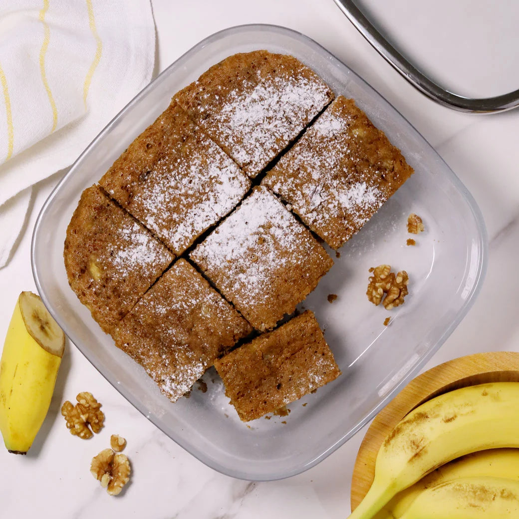 A loaf of banana bread in an Anyday dish, cooked in the microwave until soft and tender.

