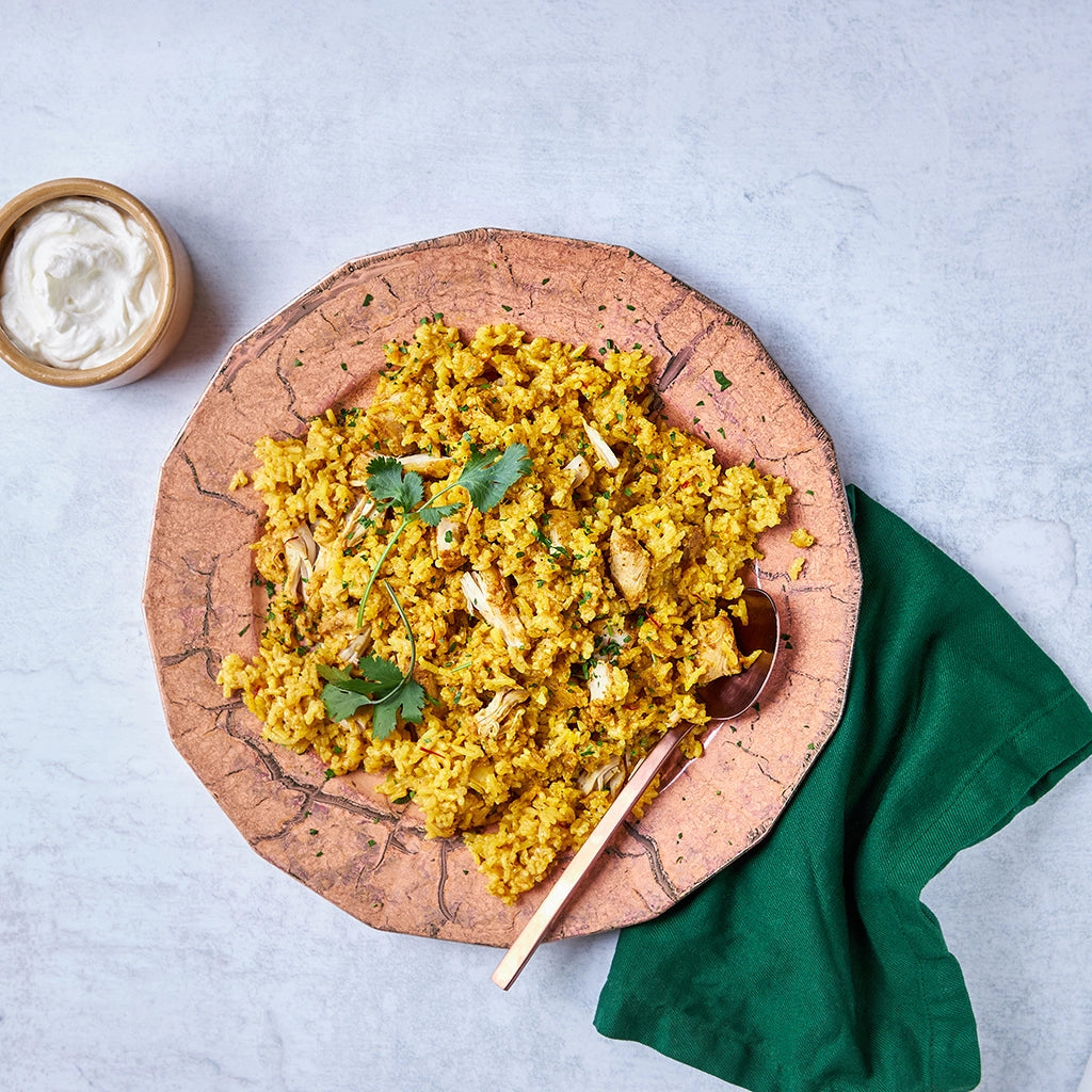 Chicken Biryani made and served in the glass Anyday dish, featuring spiced chicken, basmati rice, and fragrant herbs.