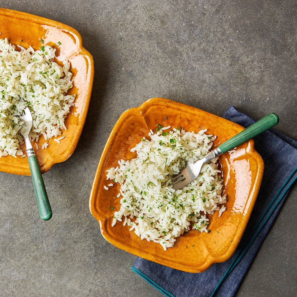 Buttery Herbed Rice made and served in the glass Anyday dish, featuring fluffy rice infused with butter and fresh herbs.