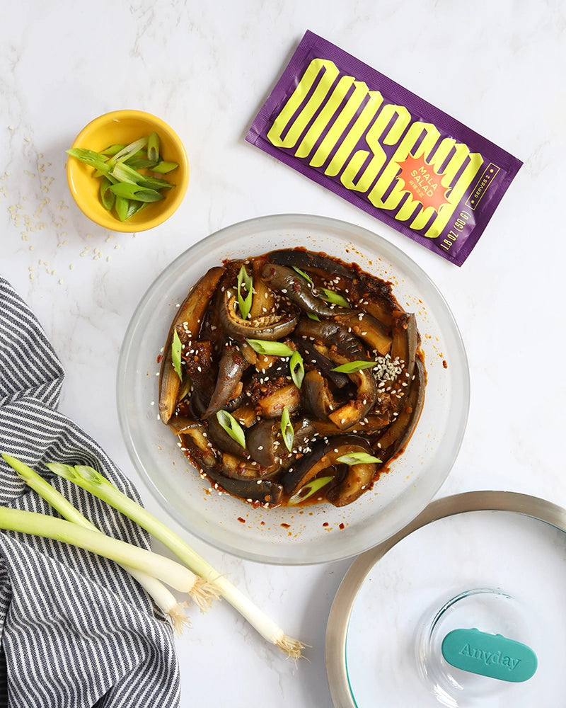 Spicy Chinese eggplant made in the glass Anyday dish, featuring tender eggplant cooked with a flavorful Omsom Chinese sauce. This quick and easy microwave recipe delivers a deliciously spicy and umami-rich dish, perfect for a satisfying meal.