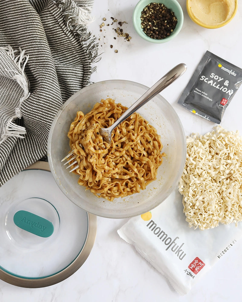 Delicious Momofuku miso cacio e pepe noodles made in the glass Anyday dish, combining tender noodles with a creamy miso and black pepper sauce. This fusion dish offers a savory and umami-rich twist on the classic Italian recipe, perfect for a quick and flavorful microwave meal.