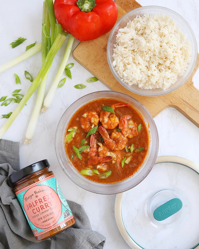 Quick and easy Maya Kaimal's Jalfrezi Shrimp made in the glass Anyday dish, consisting of shrimp simmered in a vibrant tomato, garam masala, and red pepper sauce. This method ensures tender and flavorful shrimp, perfect for a delicious meal.