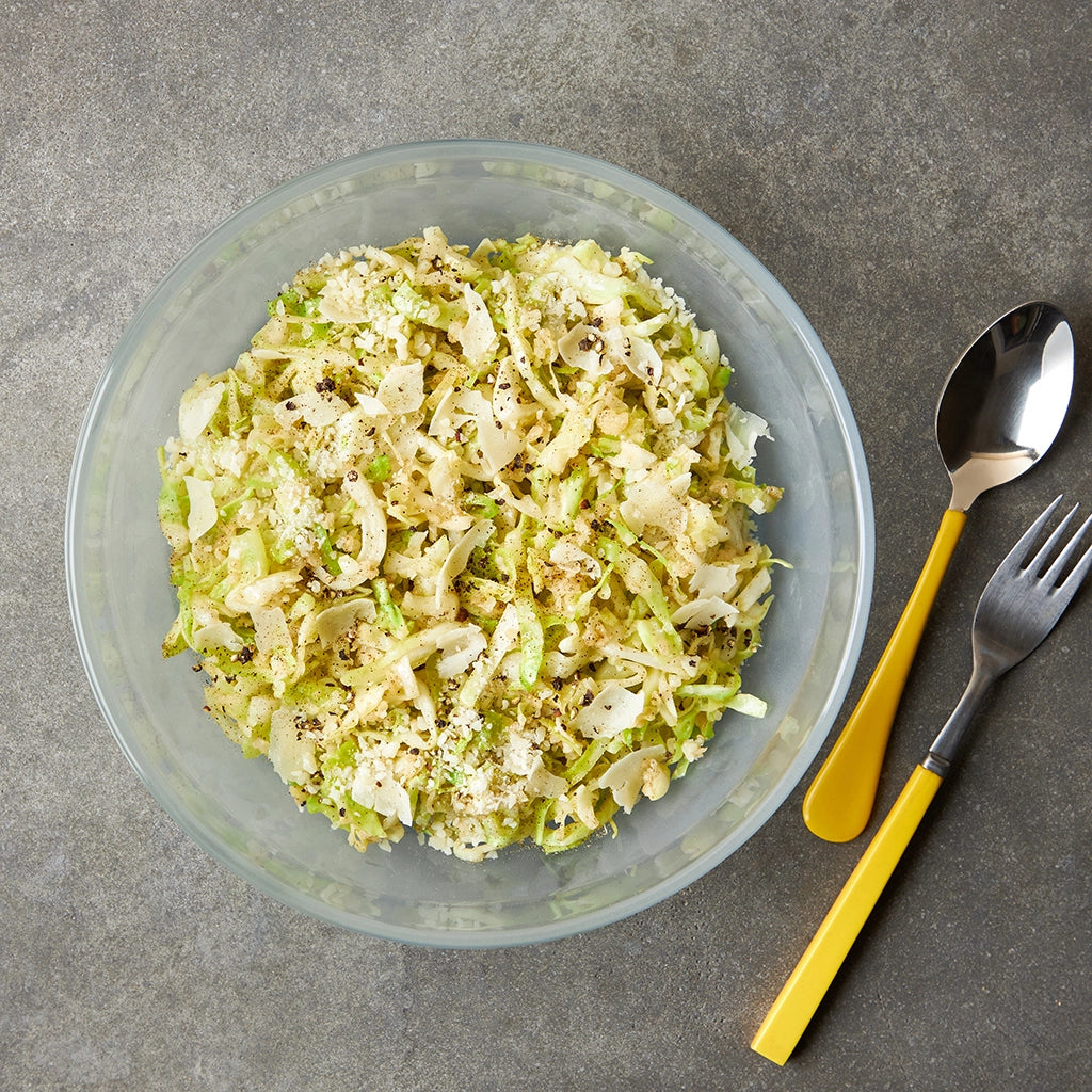 Cacio e Pepe Cabbage made and served in the glass Anyday dish, featuring tender cabbage seasoned with black pepper and Parmesan cheese.