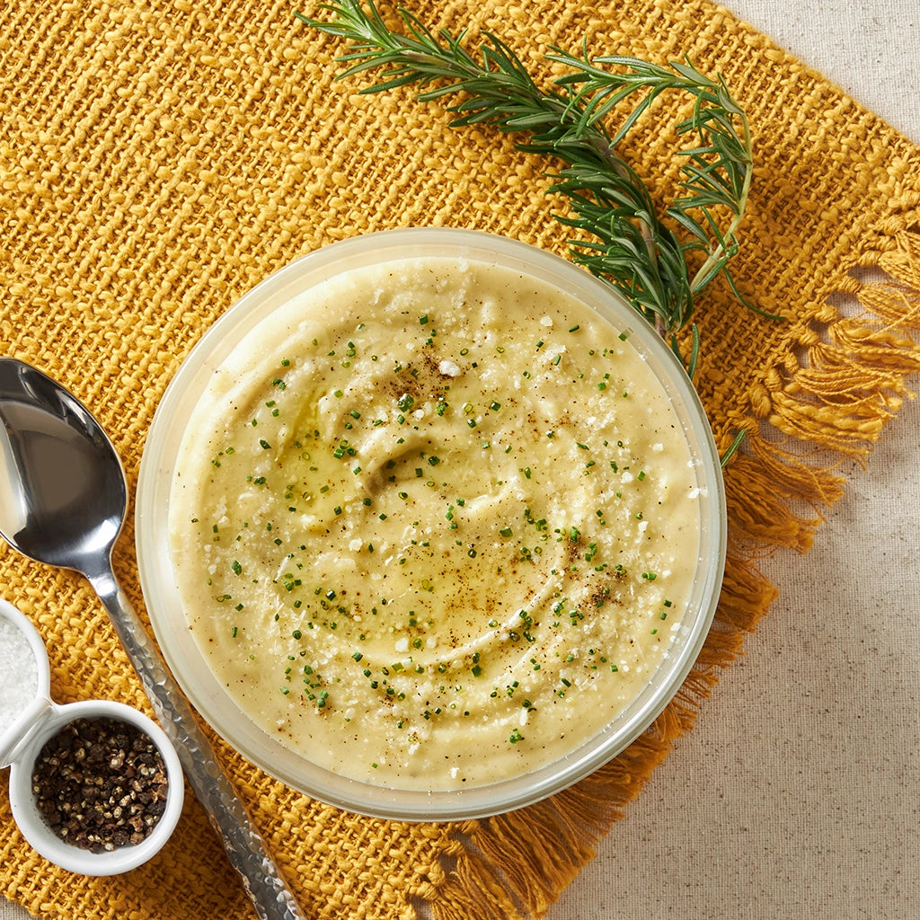 Cacio e Pepe Mashed Potatoes made and served in the glass Anyday dish, featuring creamy mashed potatoes seasoned with black pepper and Parmesan cheese.