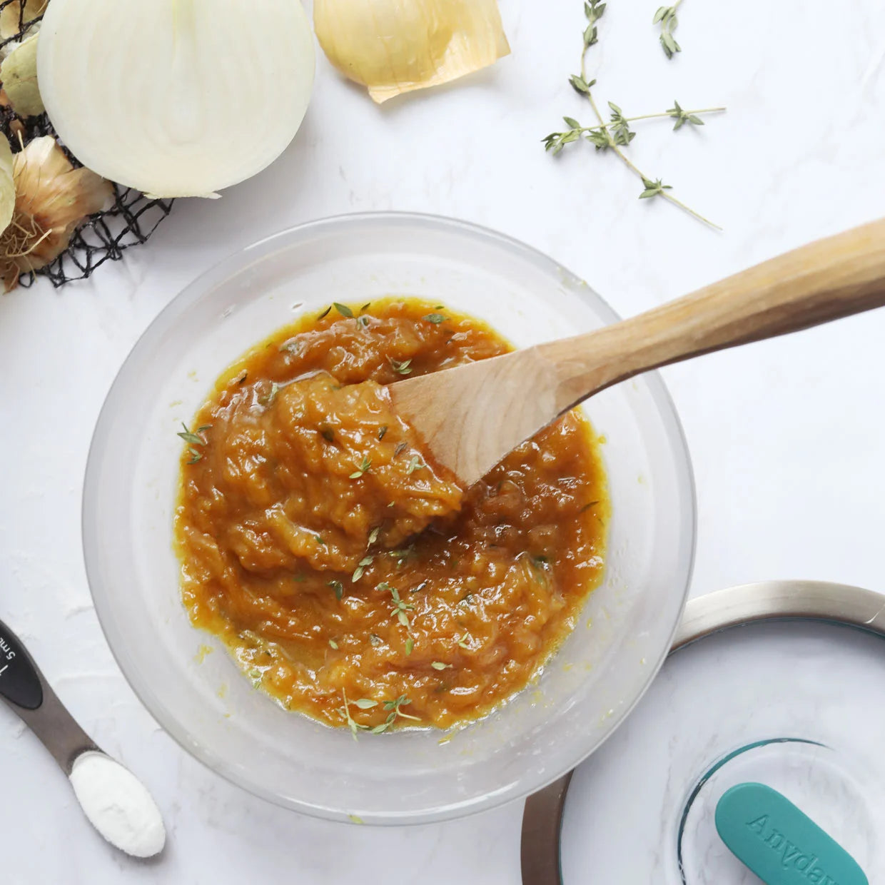 Sweet and savory caramelized onions made in the glass Anyday dish, featuring thinly sliced onions cooked to golden brown perfection. This quick and easy microwave recipe delivers rich and flavorful onions, perfect for enhancing burgers, sandwiches, or as a topping for various dishes.