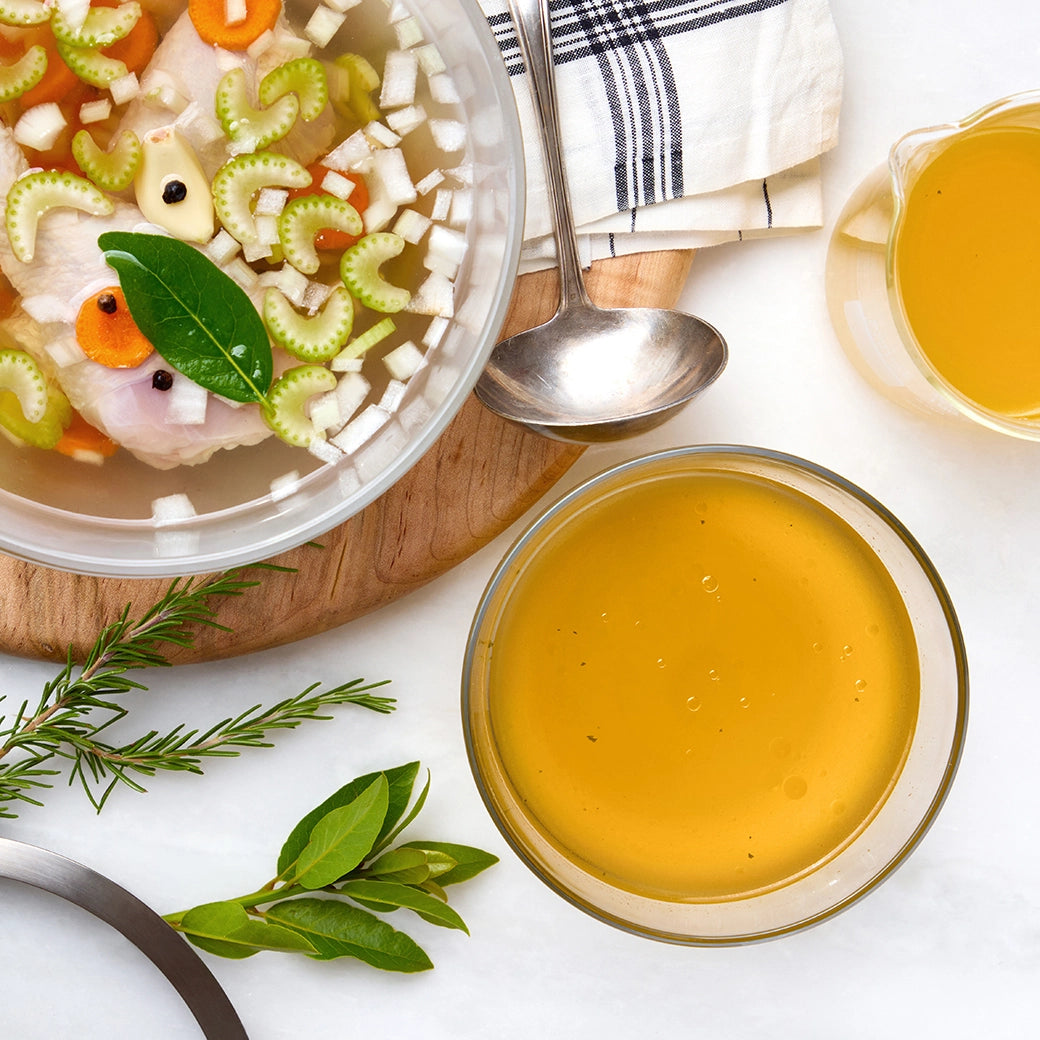 Flavorful chicken stock made in the glass Anyday dish, featuring tender chicken, aromatic vegetables, and herbs. This easy microwave recipe delivers a rich and savory homemade stock, perfect for soups, stews, and enhancing various dishes.