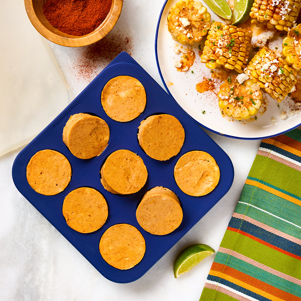 Chili lime butter portions in an Anyday Anytime Freezer Tray, perfect for elote, chicken, fish, or rice. Infused with chili powder, lime zest, and spices for bold flavor.