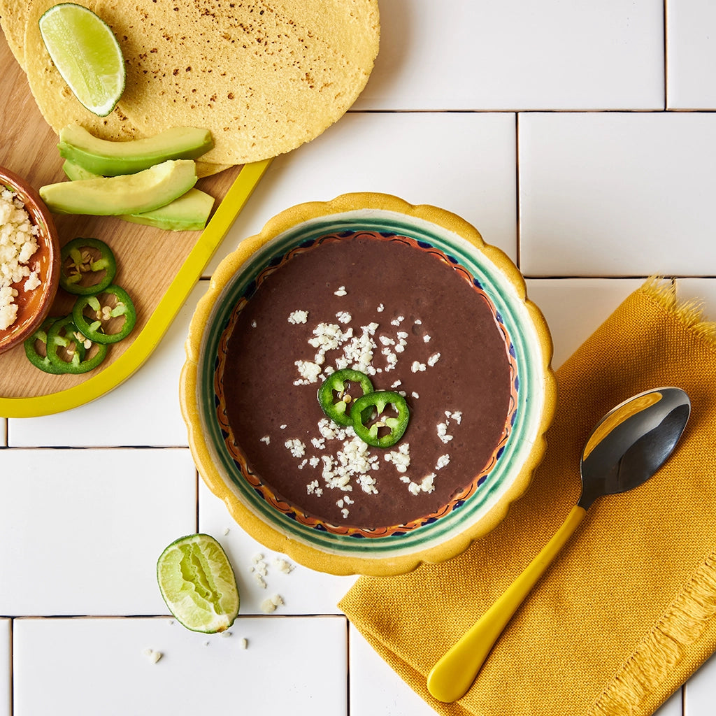 Chipotle Black Bean Soup made and served in the glass Anyday dish, featuring a hearty blend of black beans and smoky chipotle peppers.