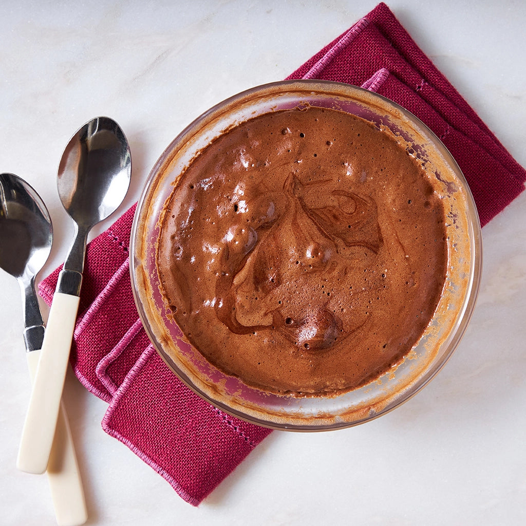 Light and airy chocolate soufflé made and served in a clear glass Anyday dish, ready to be enjoyed with a scoop of ice cream.