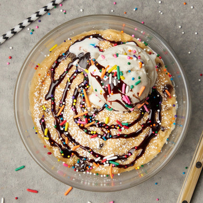 Chocolate Chip Cookie Cake made and served in the glass Anyday dish, featuring a soft and chewy cookie cake loaded with chocolate chips.