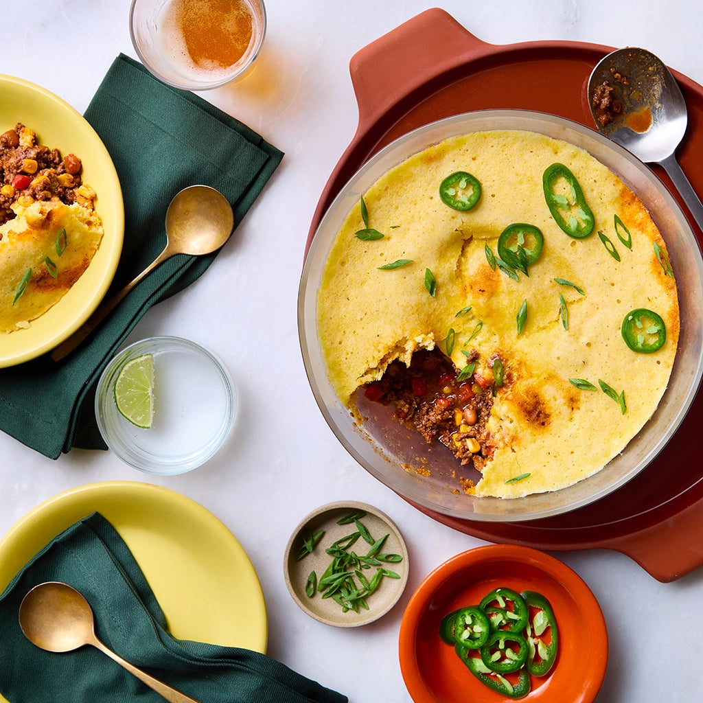 Cowboy Casserole made and served in the glass Anyday dish, featuring ground beef, beans, and cornbread top.