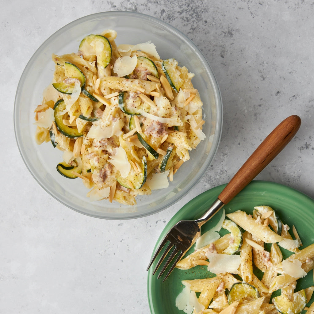 Creamy Zucchini Pancetta Pasta made and served in the glass Anyday dish, featuring tender pasta mixed with zucchini, crispy pancetta, and a rich, creamy sauce.