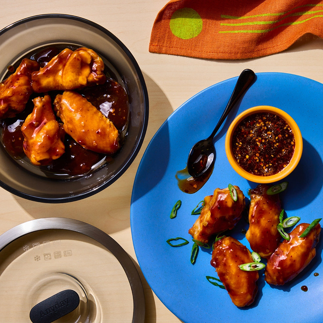 David Chang's Hot Honey Chicken Wings made and served in the glass Anyday dish, with tender wings tossed in a spicy and sweet hot honey glaze.