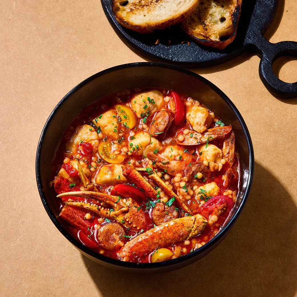 Delicious seafood medley by Chef David Chang, cooked in the microwave using the glass Anyday dish, ensuring perfectly tender seafood with no unpleasant odors. Enjoy a quick and flavorful meal that's ready in minutes.