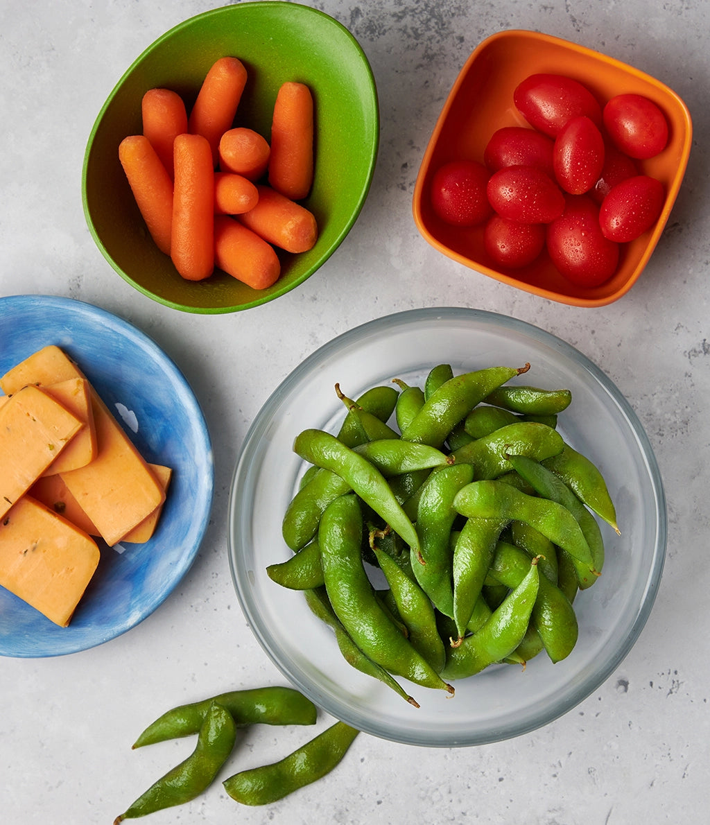 Microwave Edamame made and served in the glass Anyday dish, featuring tender, steamed edamame sprinkled with sea salt and soy sauce.