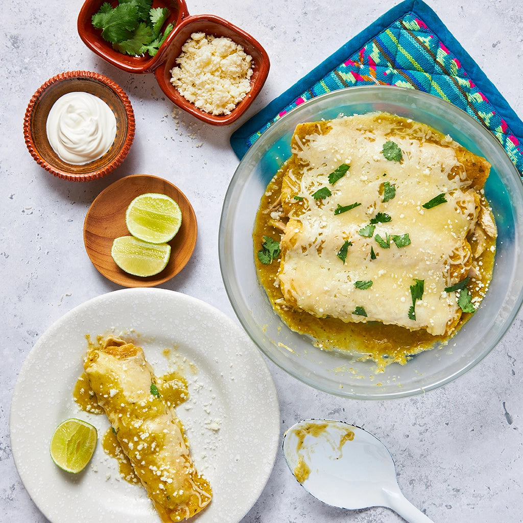 Enchiladas with Salsa Verde made and served in the glass Anyday dish, featuring rolled tortillas filled with a savory chicken filling, topped with green salsa made from scratch and melted cheese