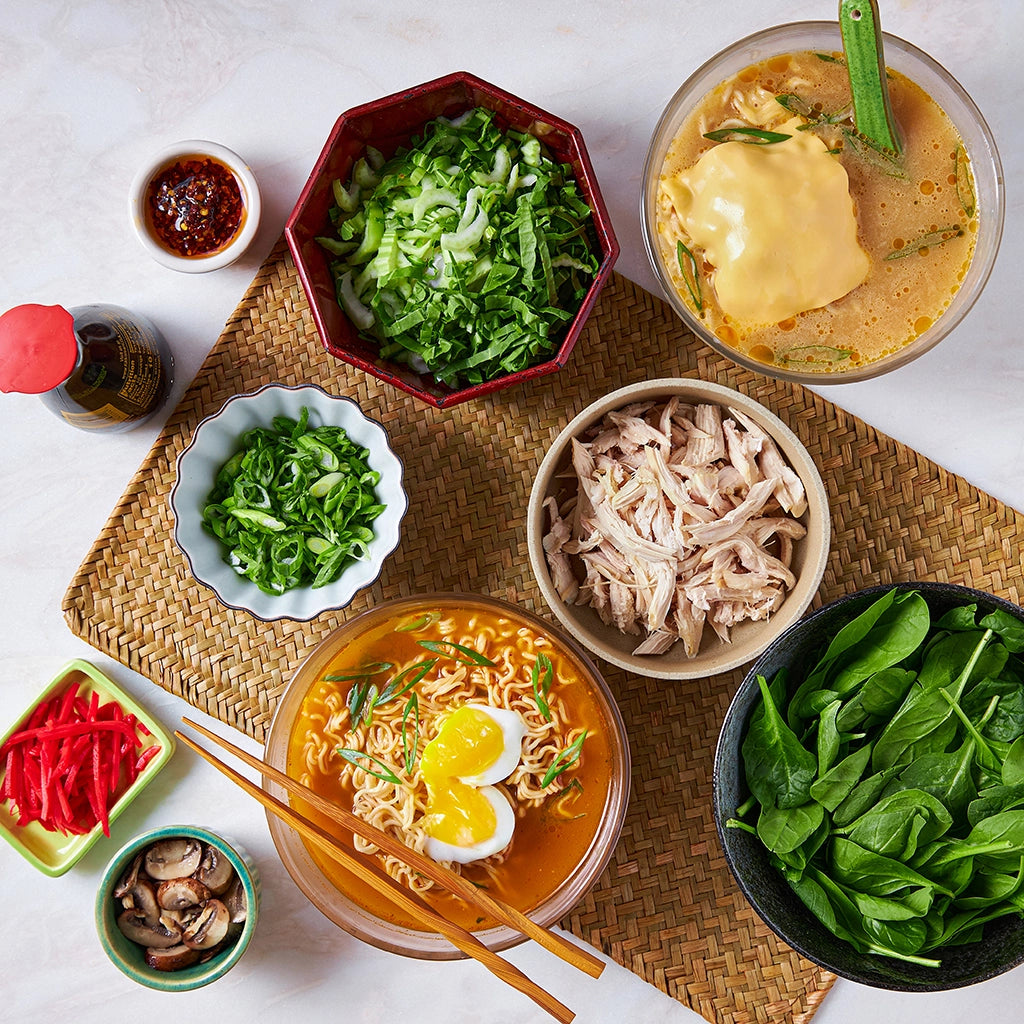 Microwave Instant Ramen made and served in the glass Anyday dish, featuring quick-cooked noodles in a savory broth, topped with fresh vegetables and a soft-boiled egg.