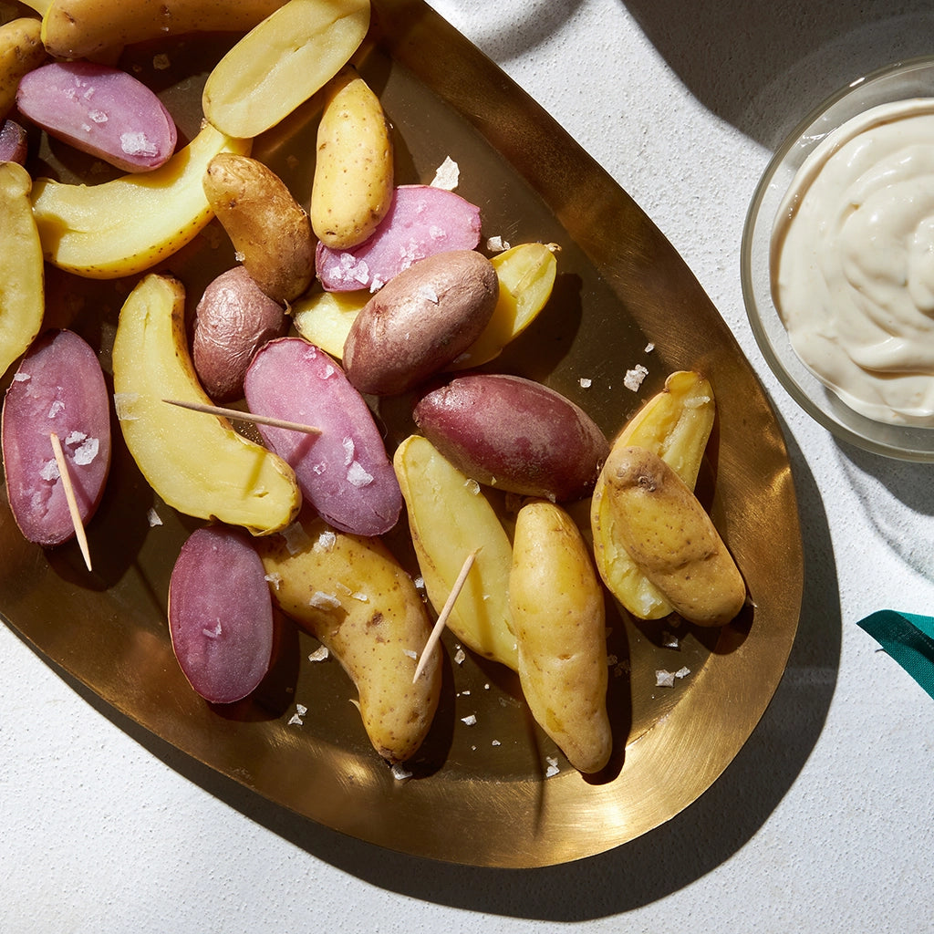 David Chang's Fingerling Potatoes with Yuzu Kosho Mayo made and served in the glass Anyday dish, featuring roasted fingerling potatoes paired with a tangy yuzu kosho mayo dipping sauce.